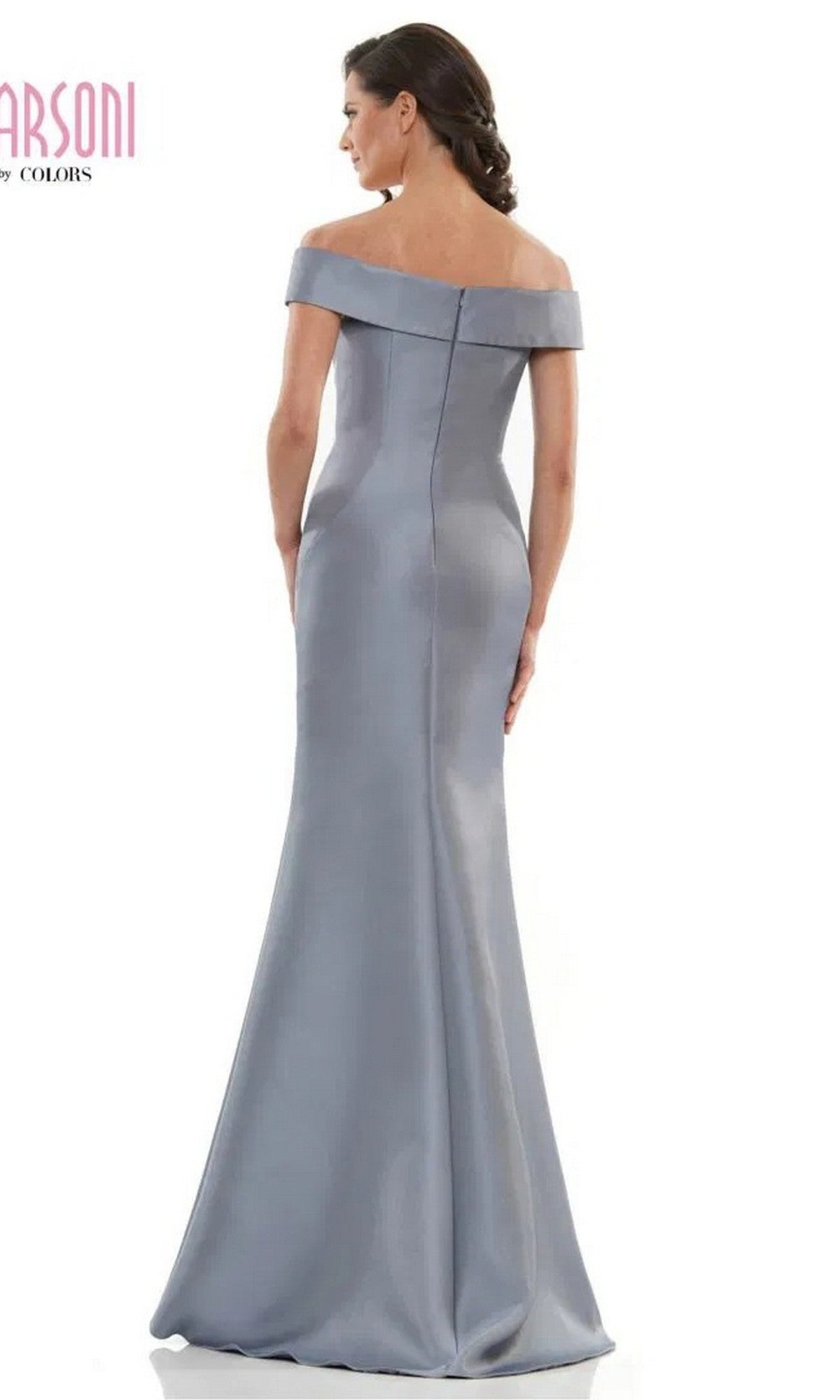A woman is seen from the back wearing the Marsoni MV1003 long formal dress in Wedgewood, an off-the-shoulder satin gown with a fitted bodice, slight flare at the hem, and delicate beaded floral embellishments for added elegance.